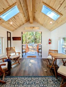 a living room with a table and chairs and skylights at Wildhaven Sonoma Glamping in Healdsburg