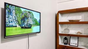 a flat screen tv hanging on a wall at Huddle Pad in Baguio