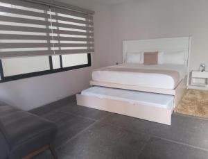 Postel nebo postele na pokoji v ubytování Aura Hotel B&B