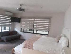 Postel nebo postele na pokoji v ubytování Aura Hotel B&B