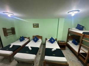 Postel nebo postele na pokoji v ubytování Hotel El Bosque