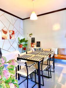 a dining room with a table and chairs at 3 bedrooms Angel's Place Transient House in Union