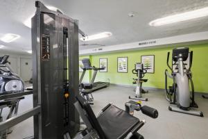 a gym with several treadmills and exercise bikes at Scenic Towers 3020 I Cozy & Comfy I Free Parking in Parma