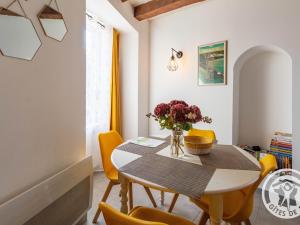 a dining room with a table and yellow chairs at Gîte historique au bord de l'eau, Angers, 2 ch., tout confort, proche commodités et loisirs - FR-1-622-15 in Bouchemaine +18 photos