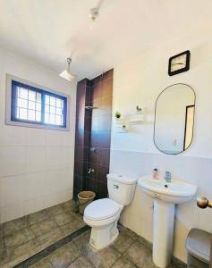 a bathroom with a toilet and a sink at Homey & spacious with private plunge pool ktv near SMtela in Santo Domingo