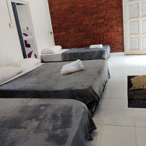 Ένα ή περισσότερα κρεβάτια σε δωμάτιο στο SIBA LODGE GUESTHOUSe