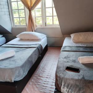 Ένα ή περισσότερα κρεβάτια σε δωμάτιο στο SIBA LODGE GUESTHOUSe