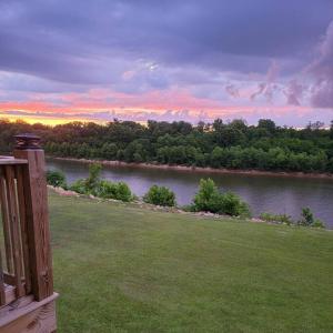 a view of a river from the deck of a house at Waterfront Bama Getaway-20 min to UA in Englewood