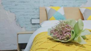 Ein Bett oder Betten in einem Zimmer der Unterkunft Breeze Alley Inn--English reception-Tourism planing