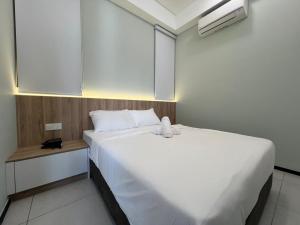 Postel nebo postele na pokoji v ubytování Cozy Urban Suites Georgetown View