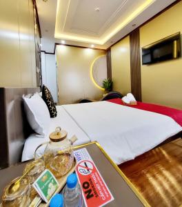 Postel nebo postele na pokoji v ubytování HA Hotel & Apartment