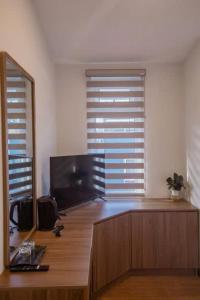 Et tv og/eller underholdning på GMP Valley Hotel DL - by BAY LUXURY + 14 billeder