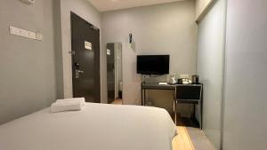 Postel nebo postele na pokoji v ubytování The Leverage Business Hotel - Rawang
