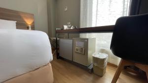 Postel nebo postele na pokoji v ubytování The Leverage Business Hotel - Rawang