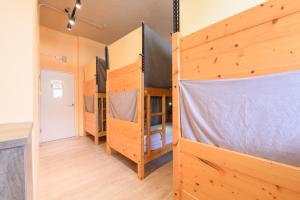 Llit o llits en una habitació de Dumbo Hostel Hualien