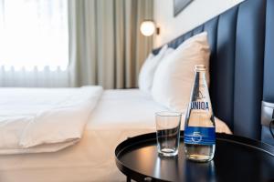 Postel nebo postele na pokoji v ubytování Žilvinas Hotel