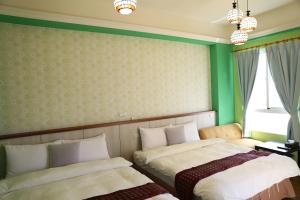 Uma cama ou camas num quarto em 輕旅小站 Soft Travel Hostel