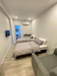 Postel nebo postele na pokoji v ubytování Cozii Home Marang