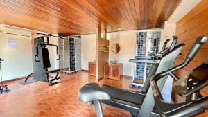 a fitness room with a gym with a treadmill at Baramee Resortel in Patong Beach