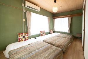 Una cama o camas en una habitación de 広尾駅徒歩2分 渋谷 六本木 表参道エリア 8宿泊可能 一棟貸切