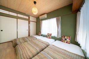 Una cama o camas en una habitación de 広尾駅徒歩2分 渋谷 六本木 表参道エリア 8宿泊可能 一棟貸切