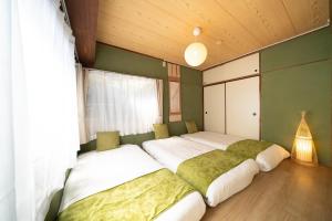 Una cama o camas en una habitación de 広尾駅徒歩2分 渋谷 六本木 表参道エリア 8宿泊可能 一棟貸切