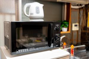 Una televisión o centro de entretenimiento en 広尾駅徒歩2分 渋谷 六本木 表参道エリア 8宿泊可能 一棟貸切