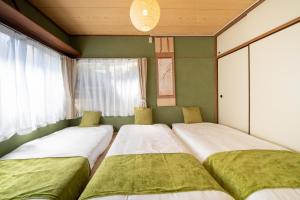 Una cama o camas en una habitación de 広尾駅徒歩2分 渋谷 六本木 表参道エリア 8宿泊可能 一棟貸切