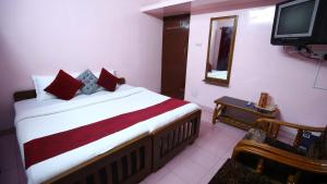 TV a/nebo společenská místnost v ubytování Janani Cottage