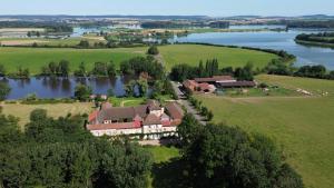 an aerial view of a large house with a lake at Château D'Alteville in Tarquimpol +28 photos