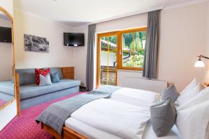 Postel nebo postele na pokoji v ubytování Gästehaus Pilz Schladming