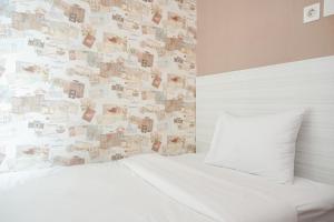 Ένα ή περισσότερα κρεβάτια σε δωμάτιο στο Scenic and Comfortable 2BR Sky Terrace Apartment By Travelio
