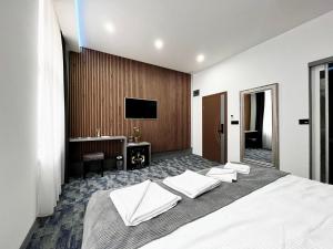 TV a/nebo společenská místnost v ubytování Residence Inn Orijent + 37 fotografií