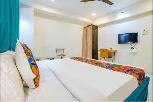 Postel nebo postele na pokoji v ubytování Hotel Bindra Elite
