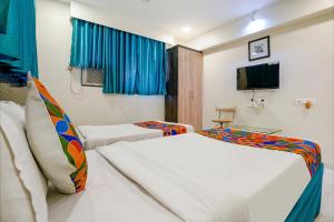 Postel nebo postele na pokoji v ubytování Hotel Bindra Elite