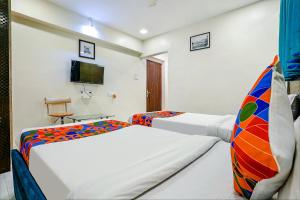 Postel nebo postele na pokoji v ubytování Hotel Bindra Elite