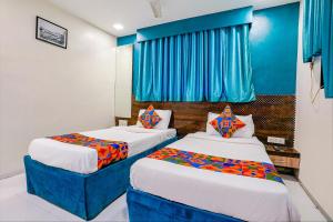 Postel nebo postele na pokoji v ubytování Hotel Bindra Elite
