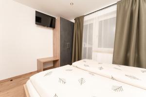 Posteľ alebo postele v izbe v ubytovaní Bergnest Oetztal Appartements Wenderkogel