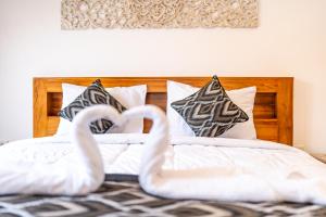 Postel nebo postele na pokoji v ubytování Ubud Ayu