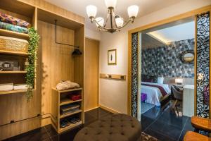 a bedroom with a bed and a mirror in a room at Cocohut Beach Resort Koh Phangan in Haad Rin