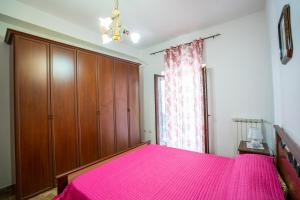 Ένα ή περισσότερα κρεβάτια σε δωμάτιο στο Peppe's home Tropea-Capo vaticano