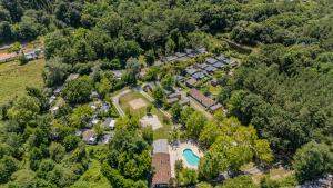 an aerial view of a mansion with a pool and trees at Mobil Home Confort Avec Clim 6 in Onesse-et-Laharie