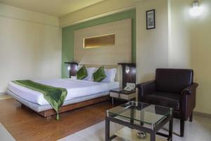 Postel nebo postele na pokoji v ubytování HOTEL ARCHANA RESIDENCY