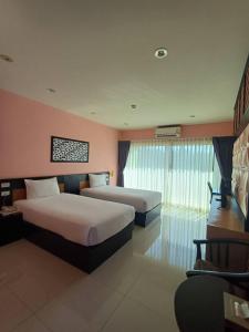 Postel nebo postele na pokoji v ubytování Phuket Chinoinn-SHAPlus Certified + 37 fotografií