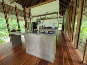 a kitchen with a large counter in a house at Dalakit House Villa Two in Siquijor