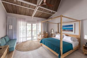 Кровать или кровати в номере Cotton Bay Resort & Spa