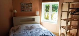 a bedroom with a bed and a window at Chambre d'hôtes Park des Collines - Gîte in Génissieux +37 photos