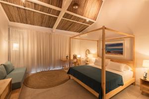 Кровать или кровати в номере Cotton Bay Resort & Spa