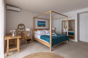 Кровать или кровати в номере Cotton Bay Resort & Spa