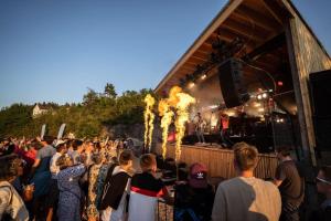 a crowd of people standing in front of a stage at Kragerø Resort in Kragerø +102 photos